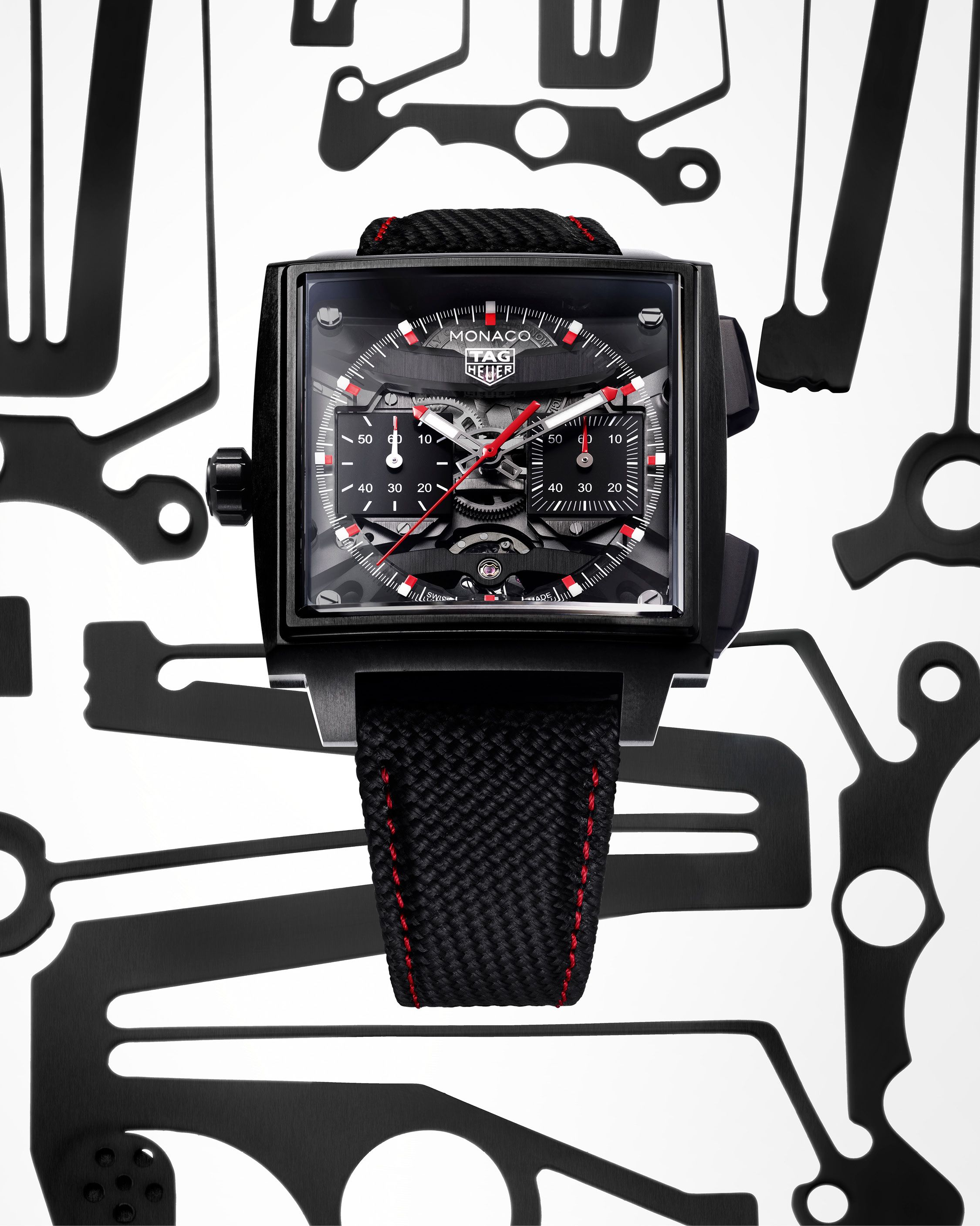 TAG Heuer Monaco Skeleton chronograph watch with black openworked dial and square motorsport-inspired case