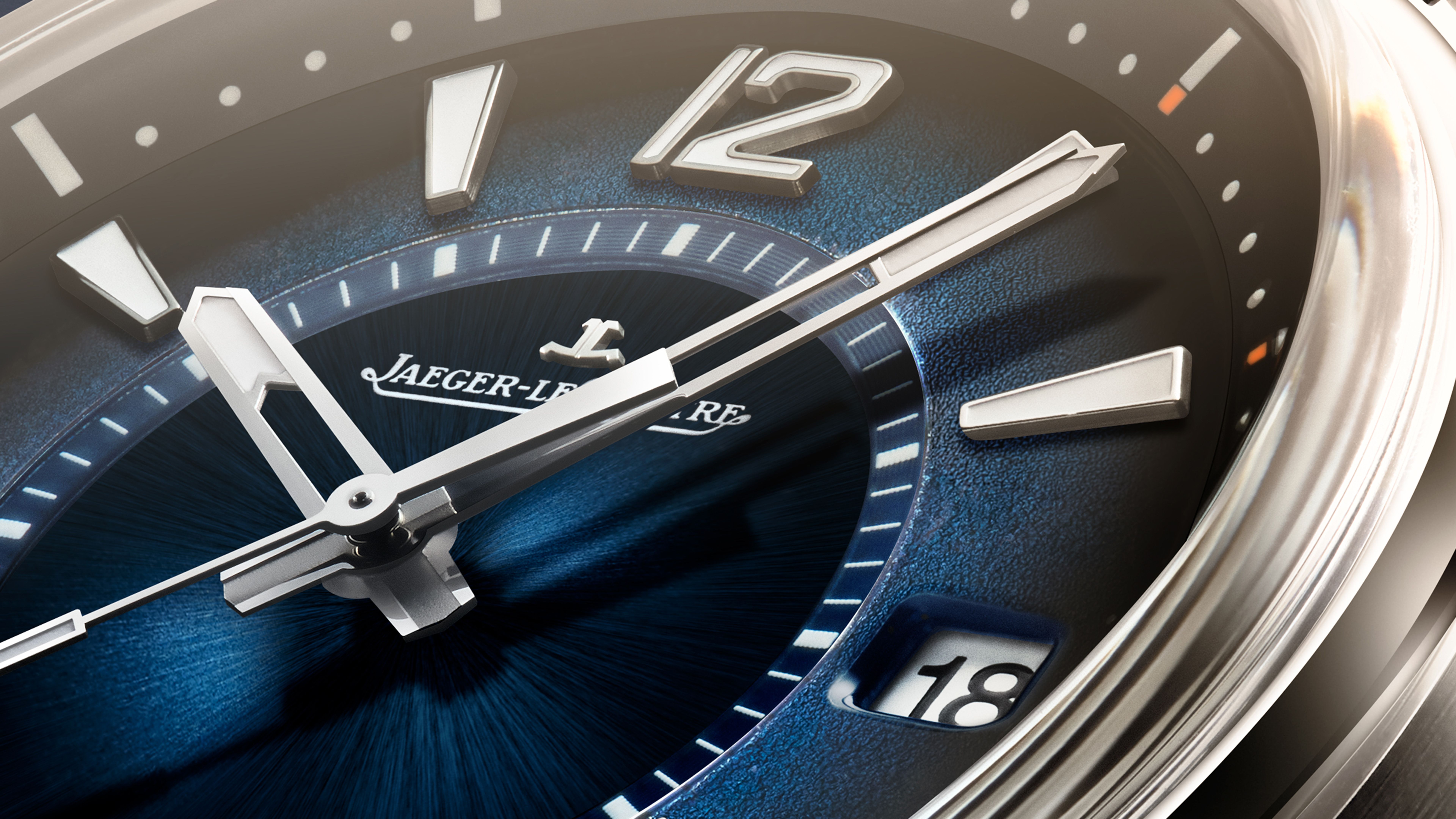 Close-up of the Jaeger-LeCoultre Polaris Date featuring a blue gradient dial, internal rotating bezel, and sporty luxury watch design