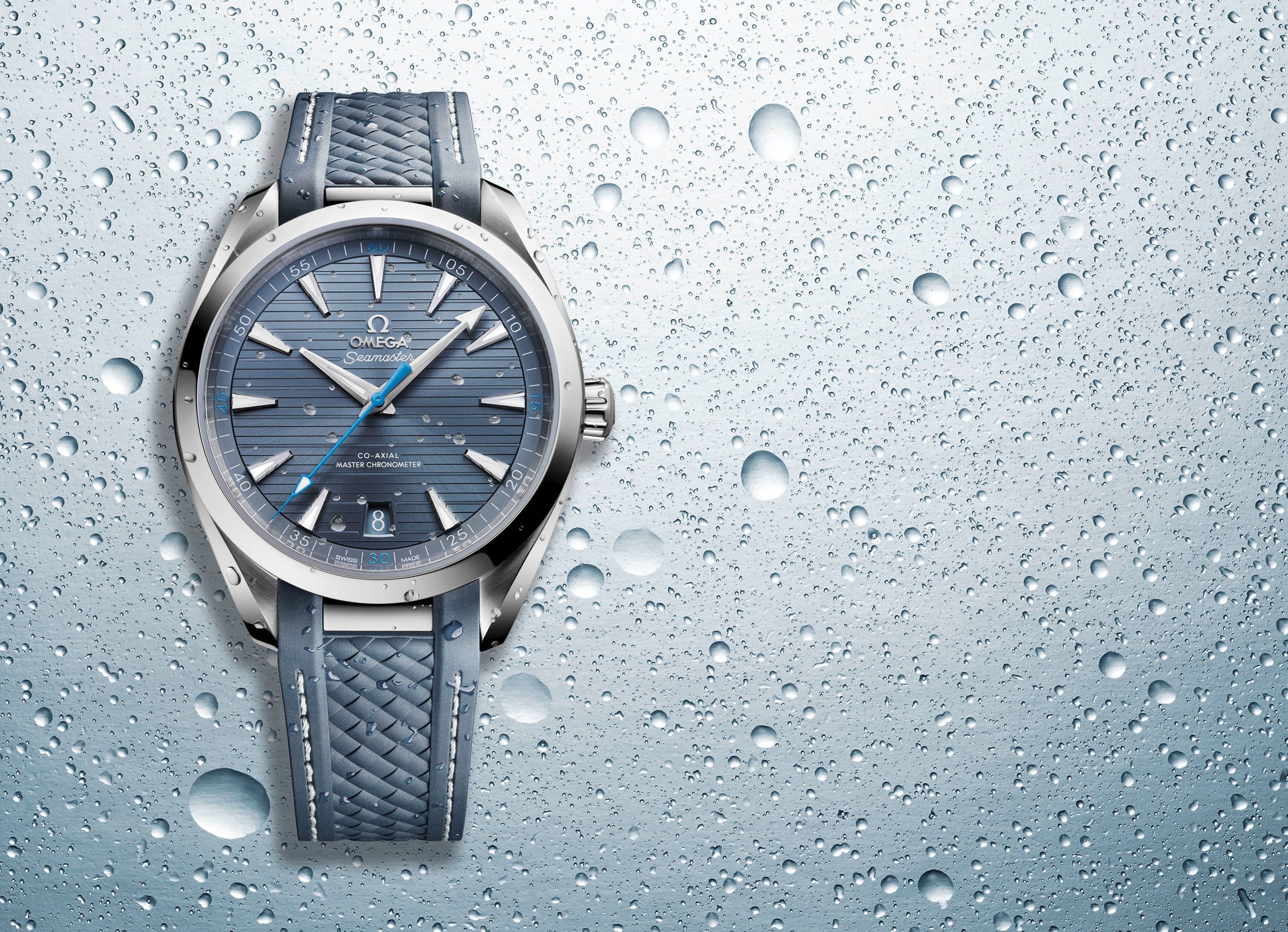 Omega Seamaster luxury watch with blue rubber strap highlighting the best waterproof strap choice for monsoon watch care