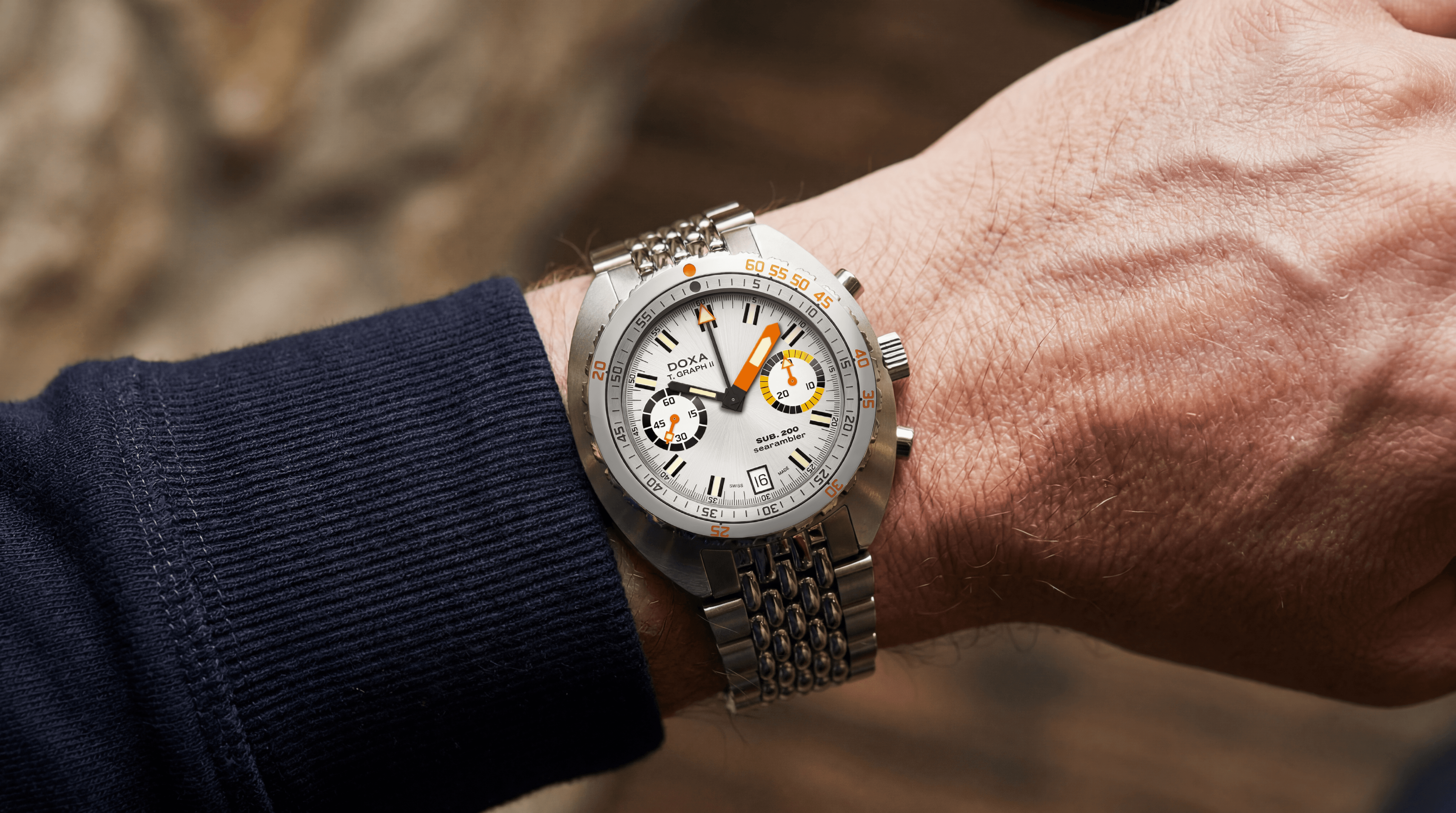 DOXA SUB 200 T.GRAPH II Searambler on the wrist with stainless steel beads-of-rice bracelet, highlighting the legendary dive watch's refined proportions and chronograph design.