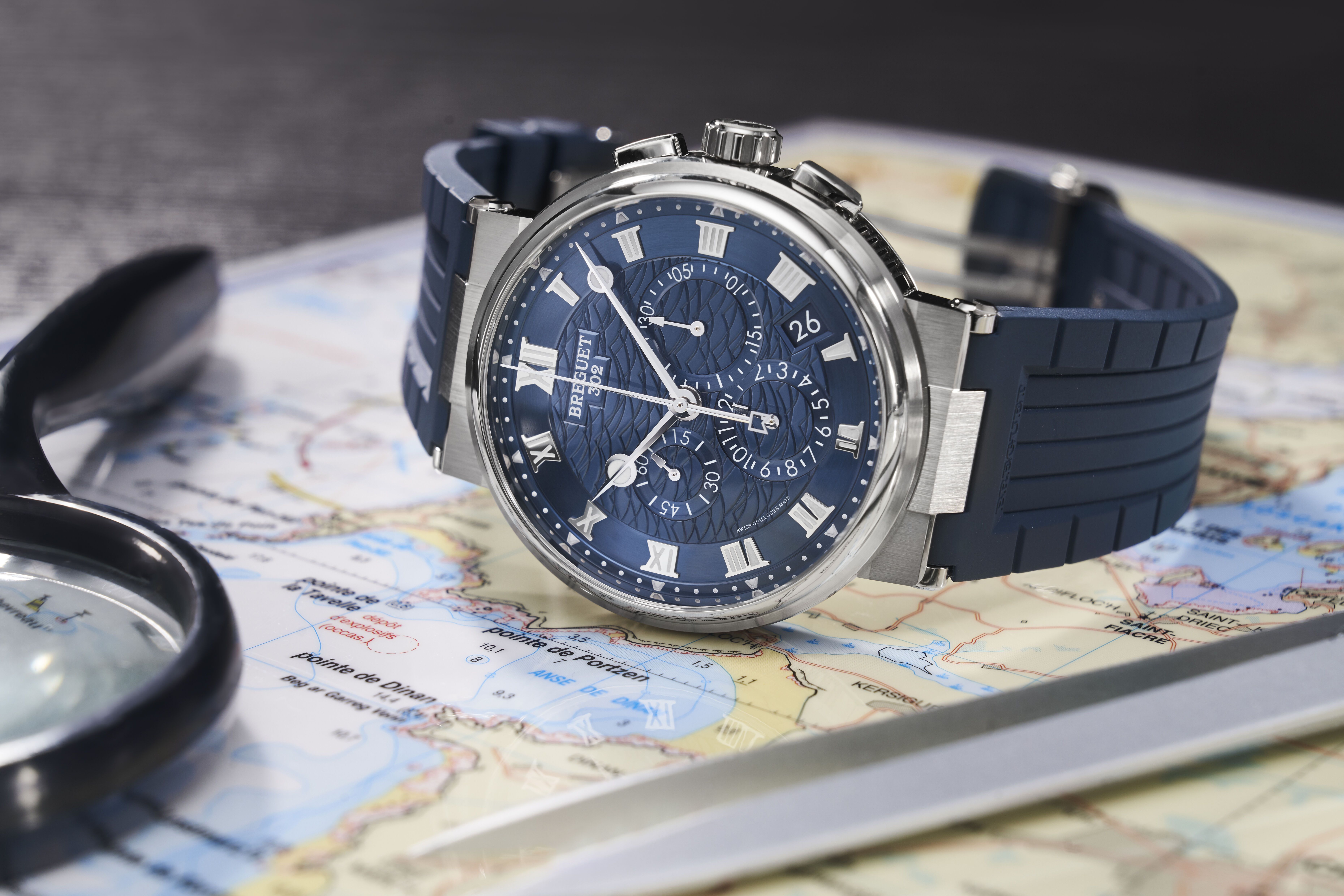 Breitling chronograph with blue rubber strap illustrating why hair dryers and artificial heat should be avoided when drying a wet watch