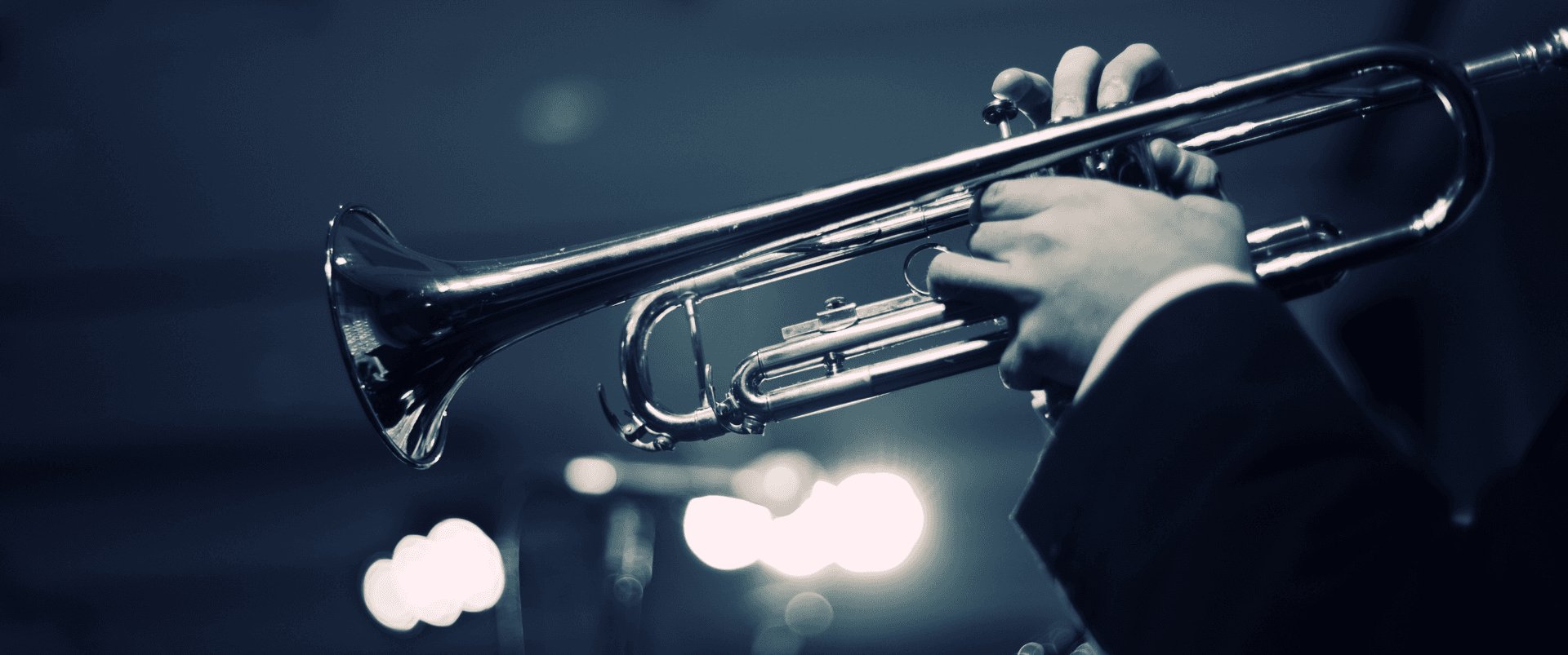 Jazz musician playing trumpet representing the 1917 era that inspired the Movado Heritage 1917 Collection and its Art Deco design language