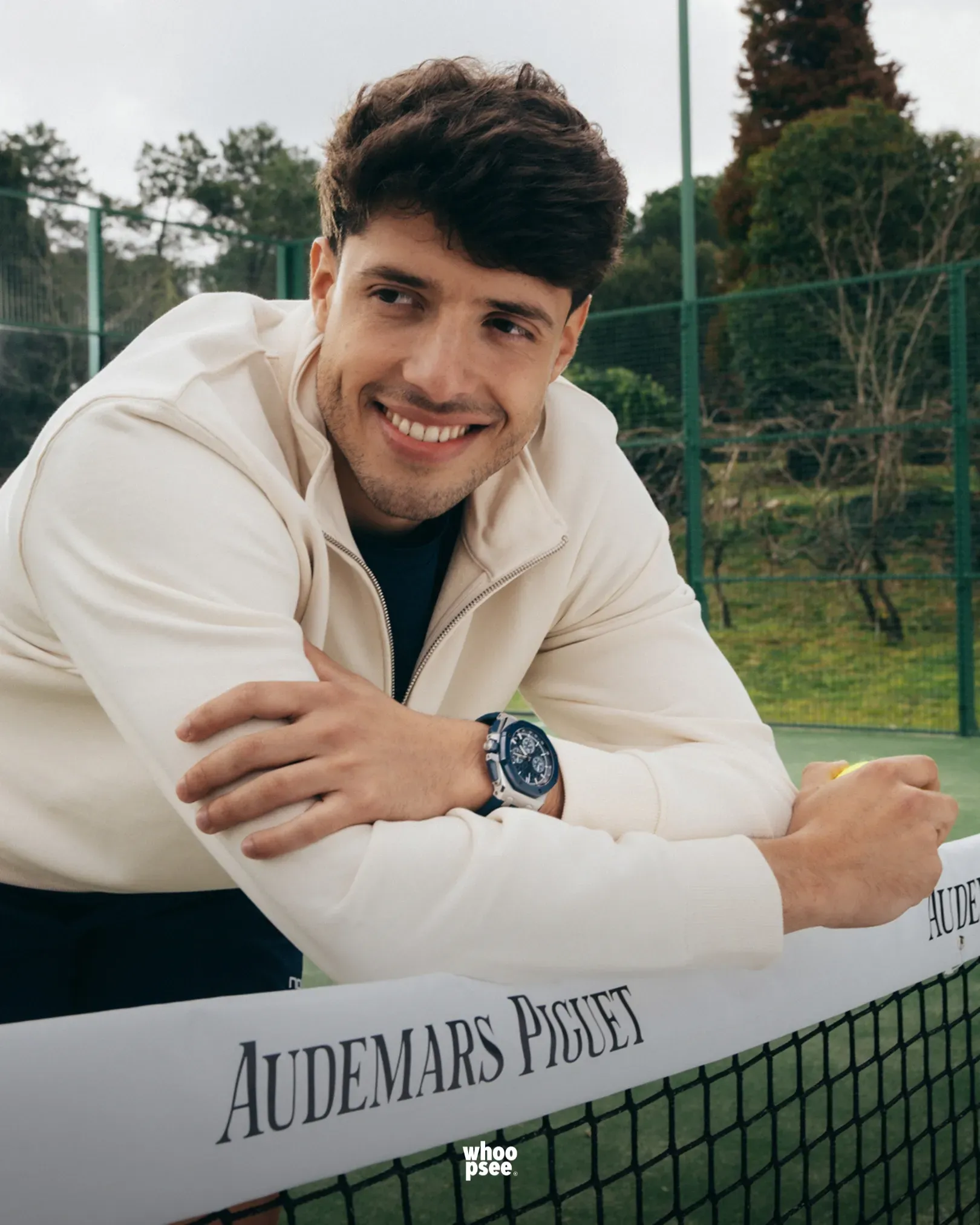 Agustin Tapia wearing an Audemars Piguet Royal Oak watch beside a padel court during AP partnership campaign