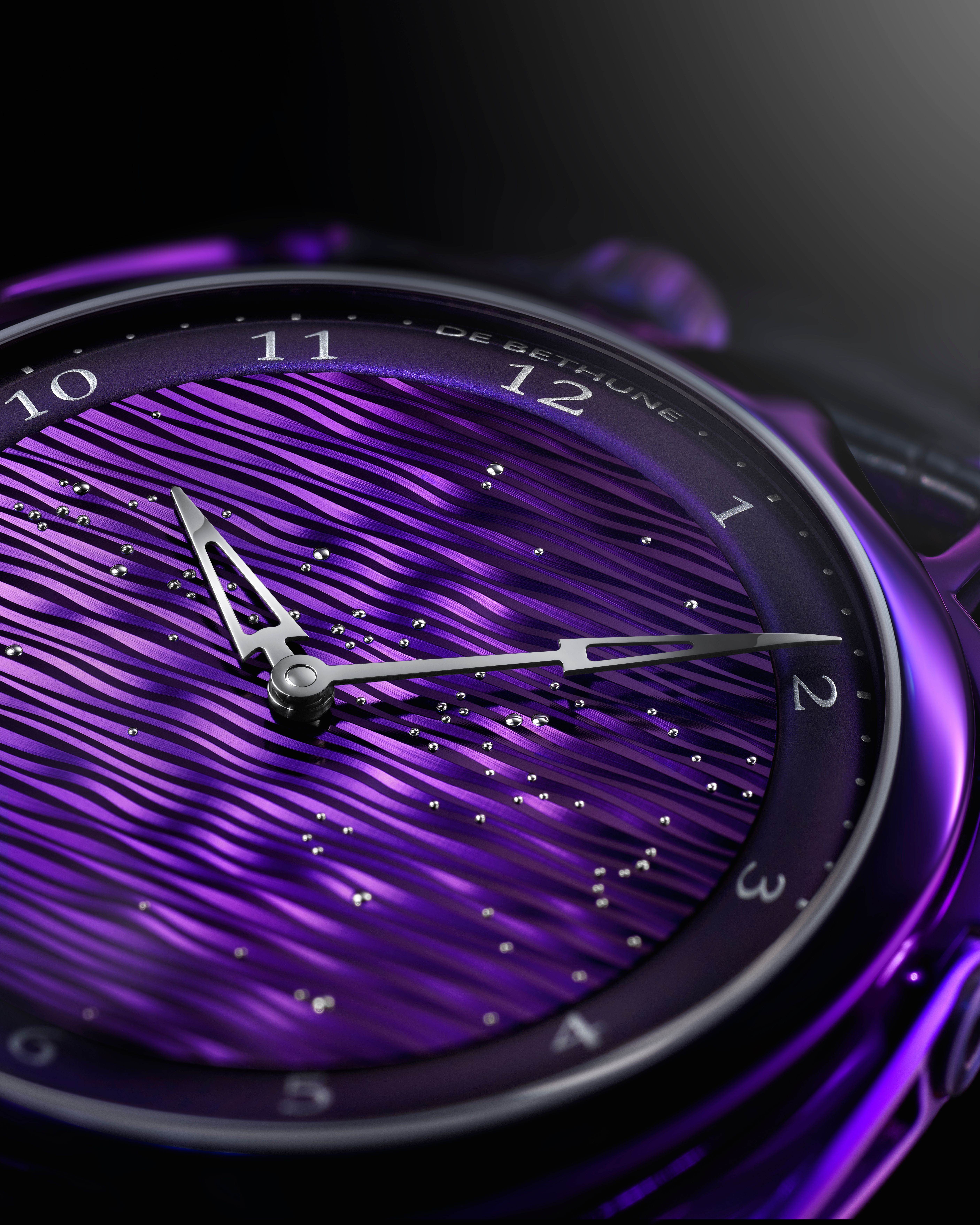 The heat purpled treatment extends to the titanium case, dial, floating lugs and the pin buckle as well