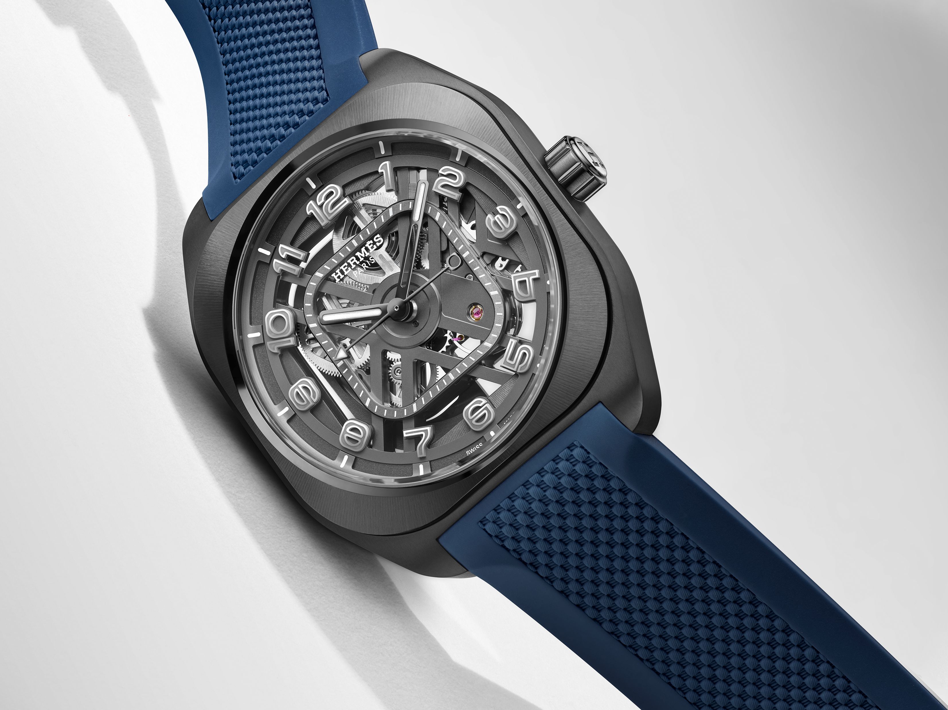 Hermès H08 Squelette skeletonized luxury sports watch with openworked titanium movement and blue rubber strap