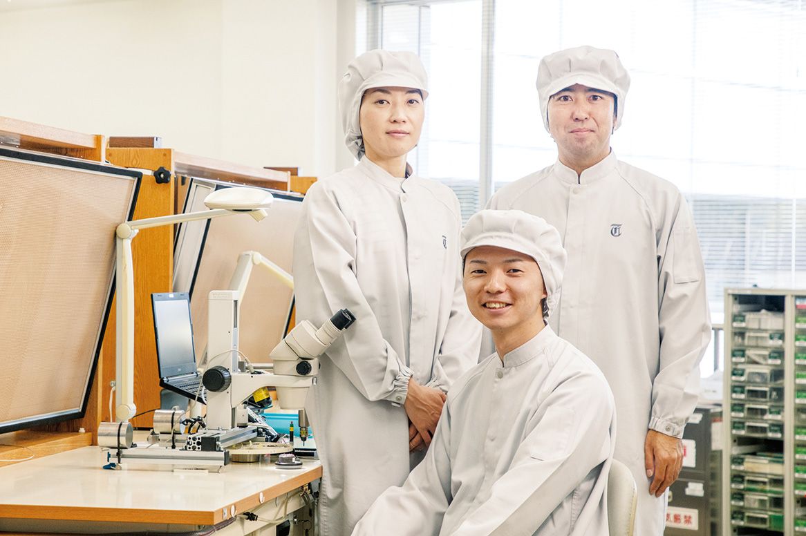 Hiroki Soma (front), Kaori Washimi (back left), Shun Murayama (back right). All three are certified watchmakers who assemble movements and cases at the Shinshu Watch Studio..jpg