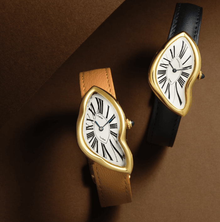 Two Cartier Crash watches with yellow gold cases and leather straps highlighting iconic melted design