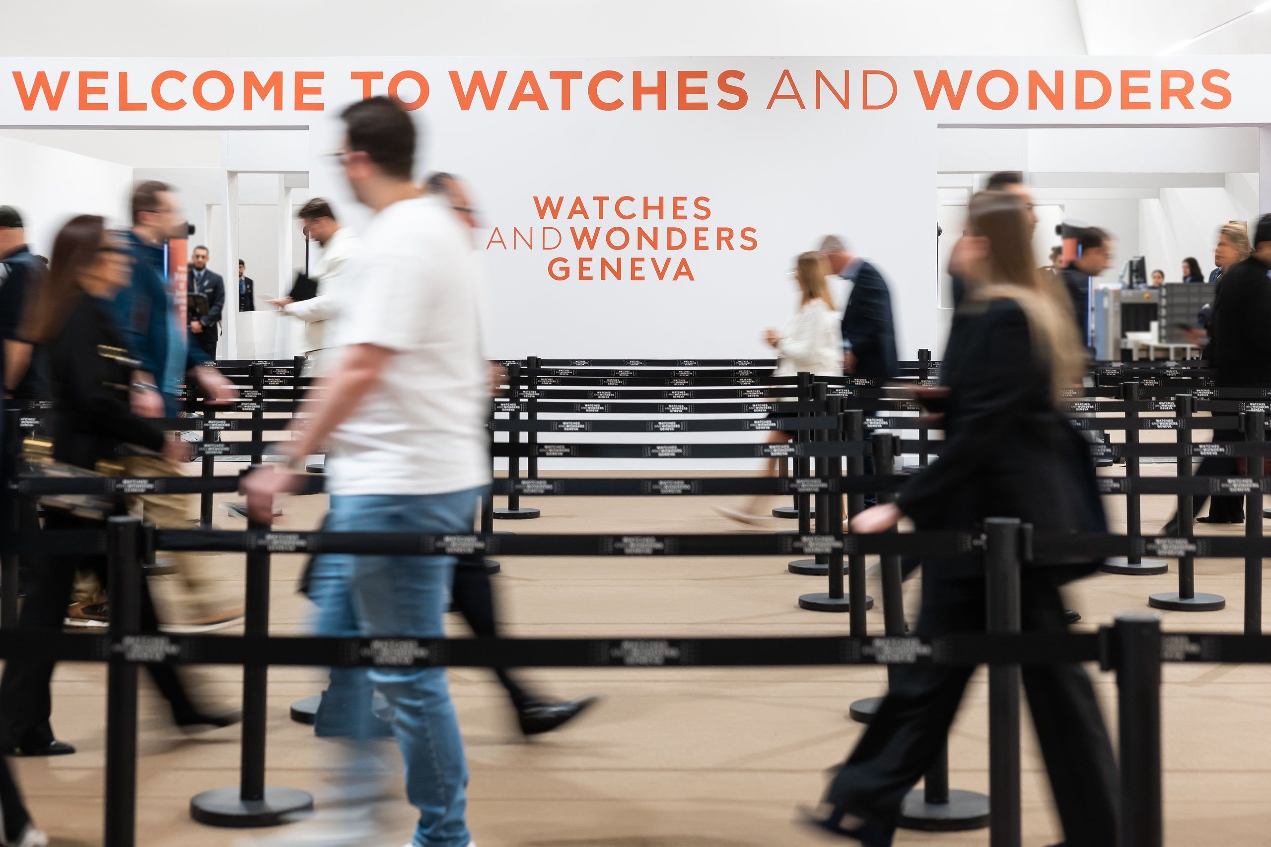 Watches And Wonders Geneva event entrance crowd inside exhibition hall luxury watch fair