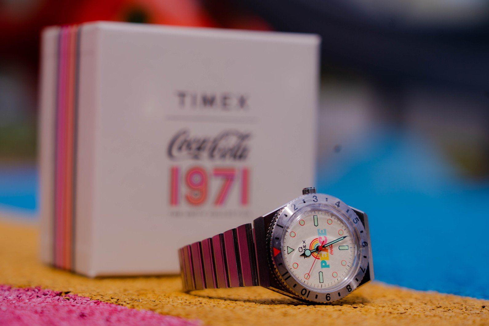 Q Timex, detailed with vintage hues and designs from the 70s.