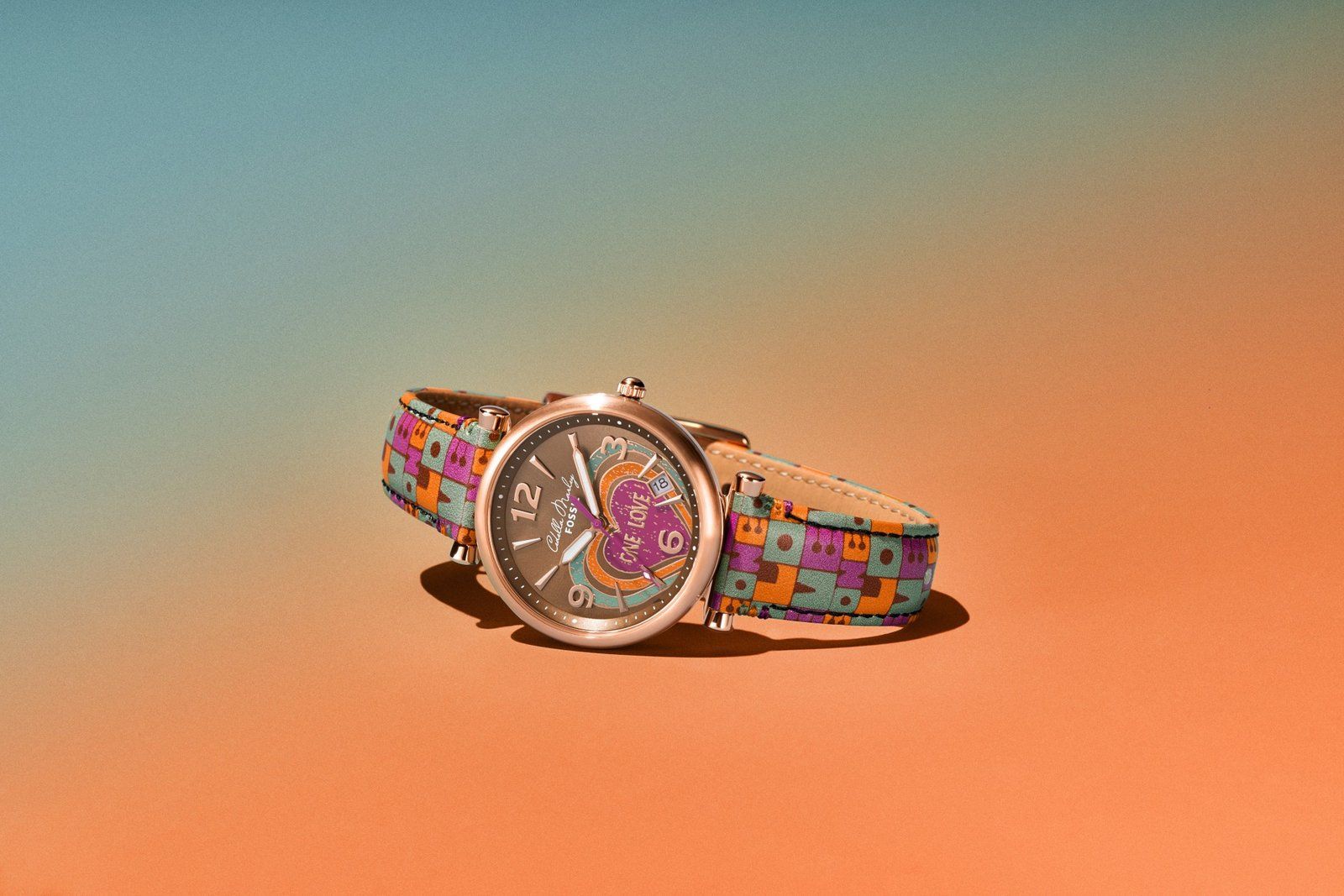 The set includes a multi-colored, replaceable watch strap in addition to the 35MM rose gold-tone watch and bracelet. 