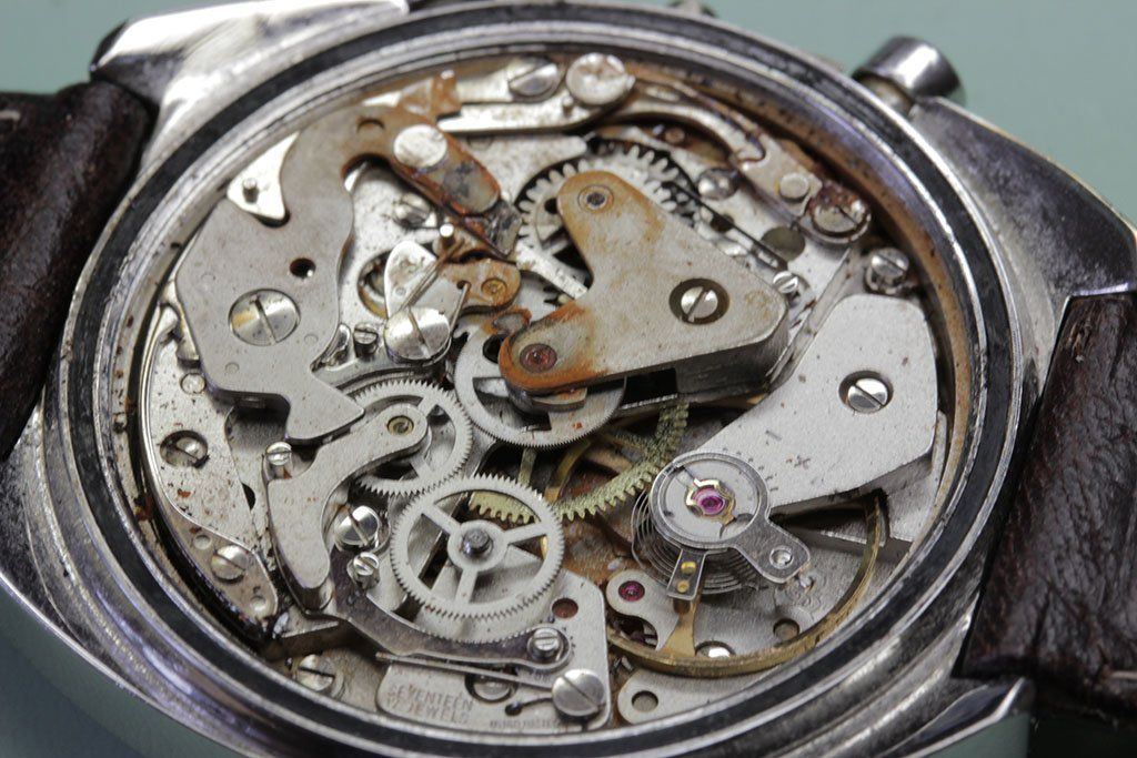 Signs of water damage on a watch caliber as seen on corroded parts