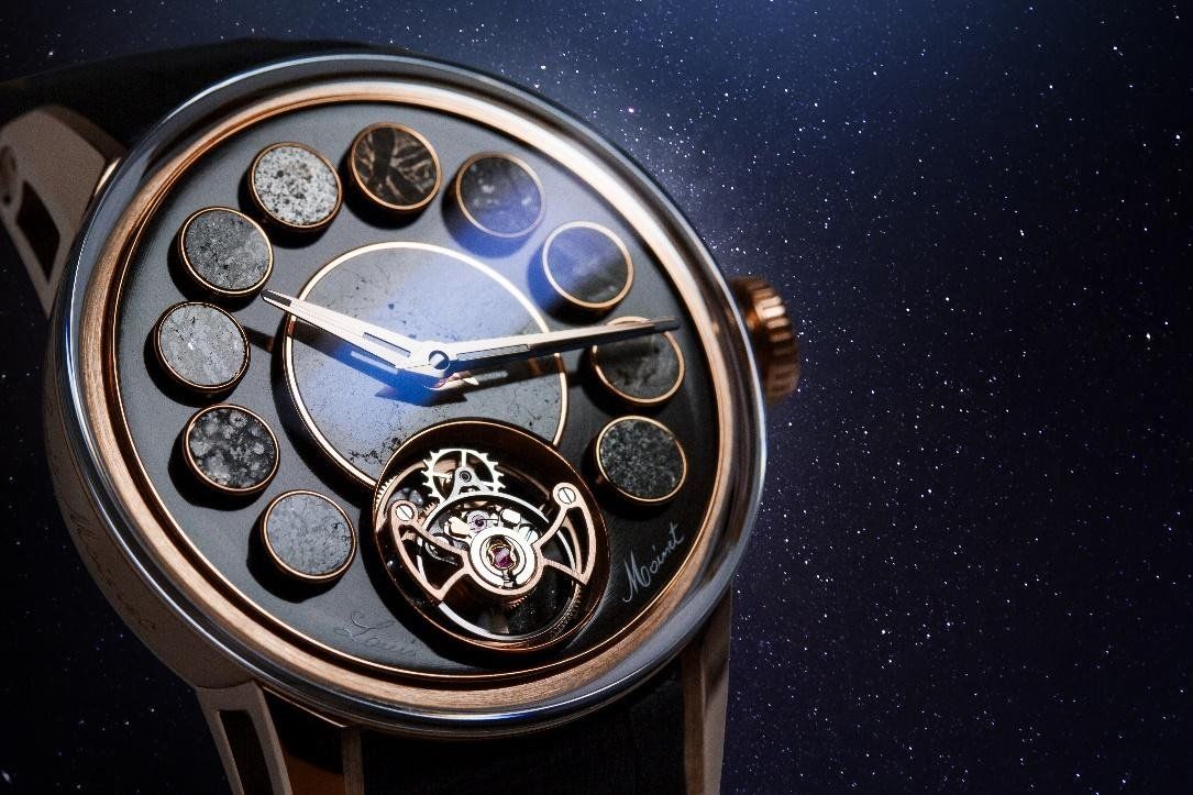 The Louis Moinet Cosmopolis features 12 meteorite fragments attached to a dark-gray brushed dial.