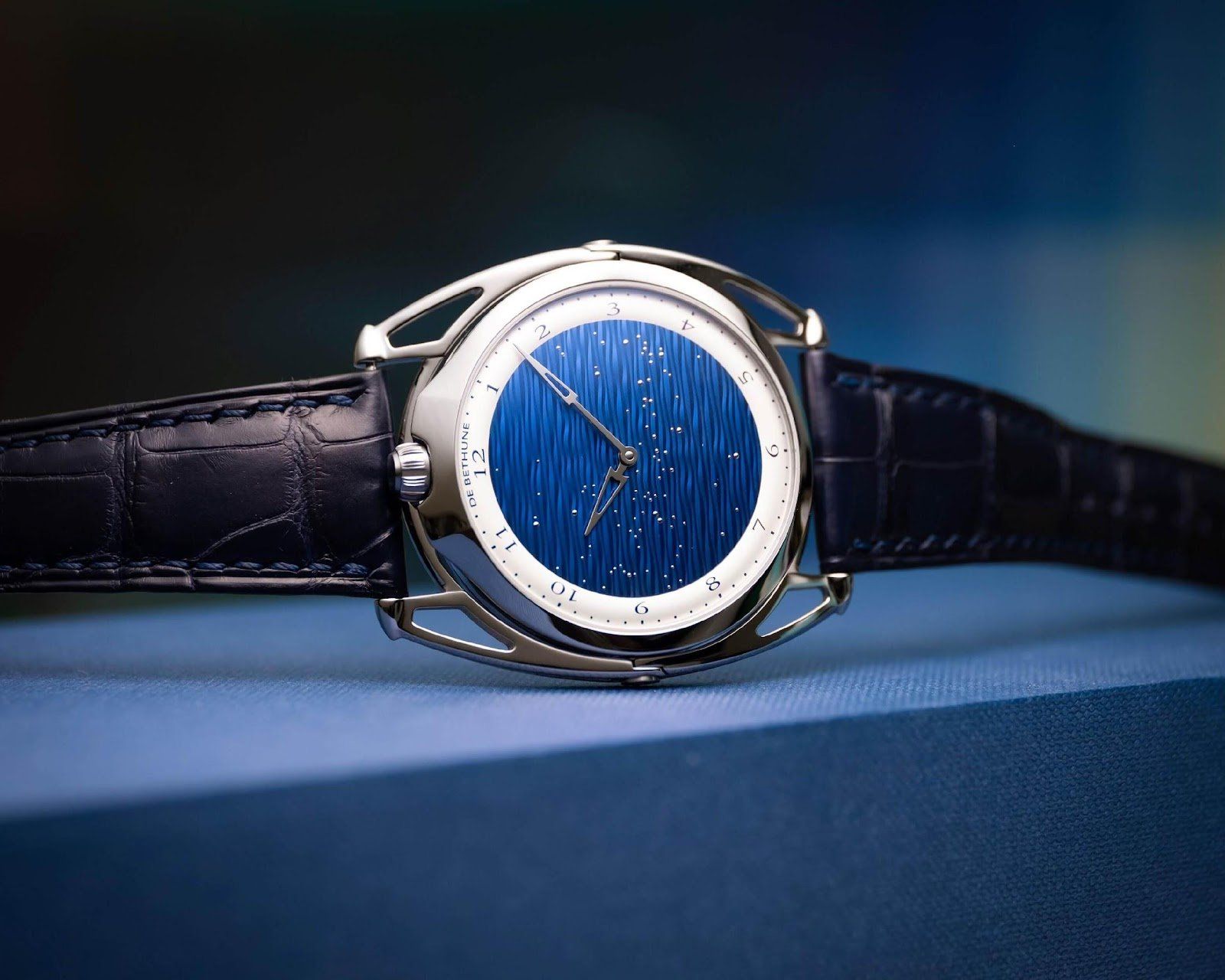This timepiece has a blued titanium dial featuring a wave reflecting a starry sky