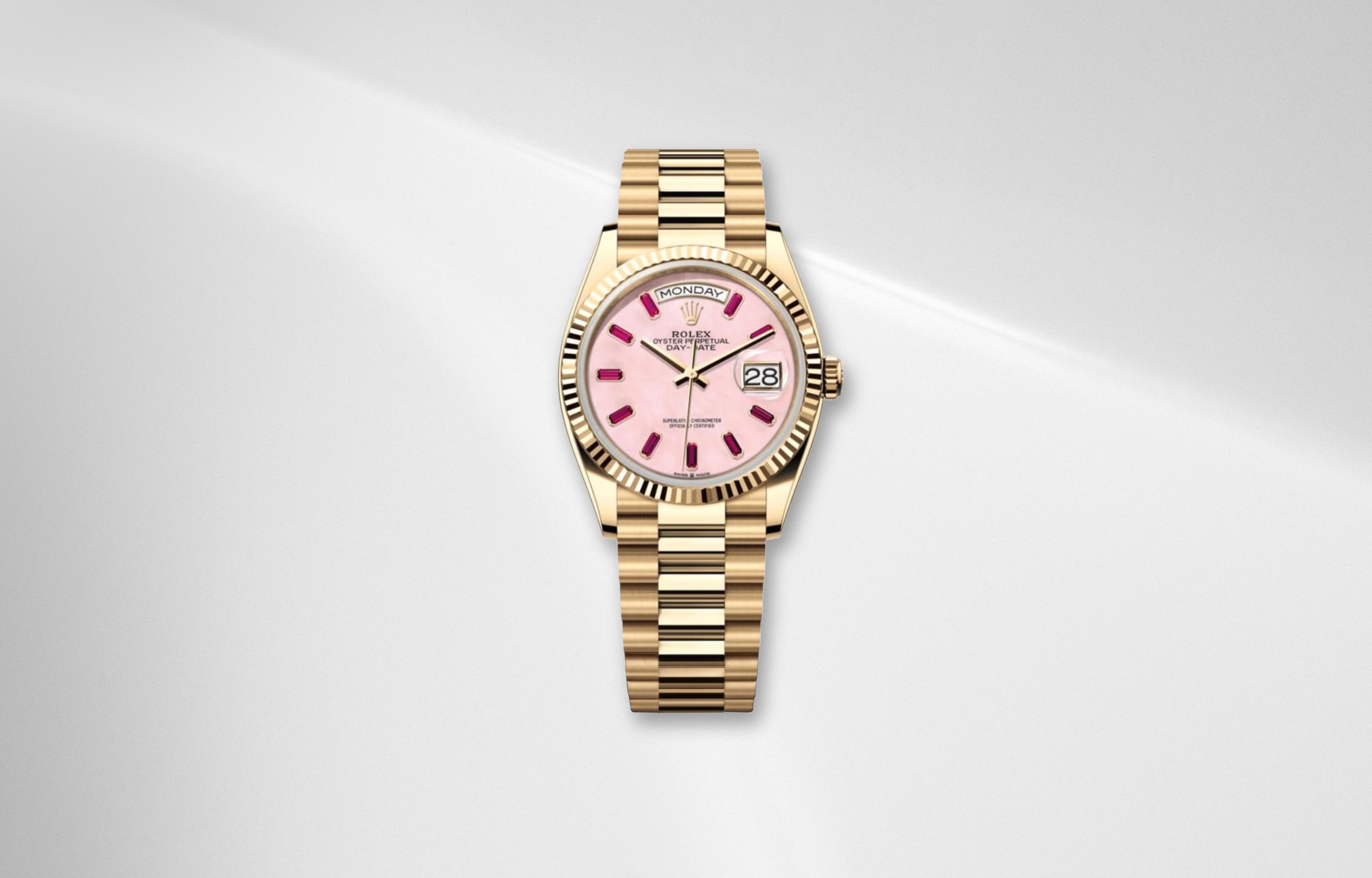 Rolex Day Date 36 pink opal dial in yellow gold with ruby hour markers and President bracelet